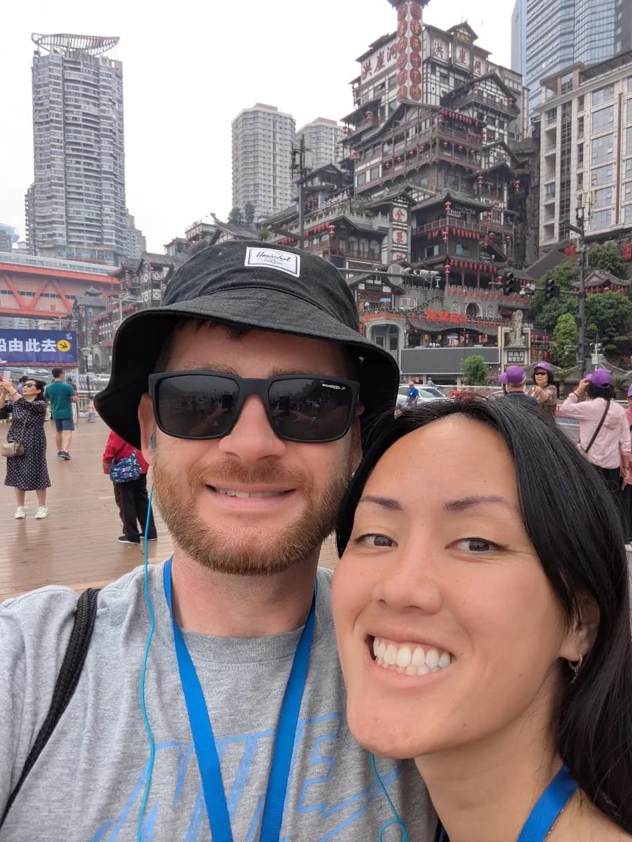 Us in Chongqing, in front of the stacked towers of Hongya Cave